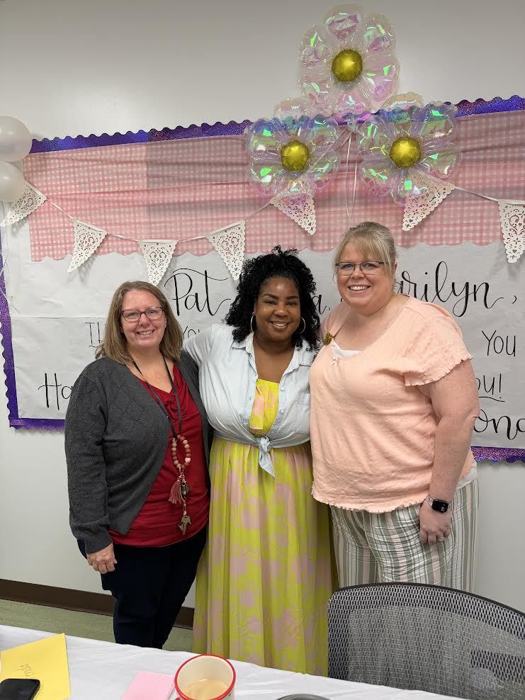 Mrs. Naas, Mrs. Harris, and Mrs. Chandlee stand proudly together as they are celebrated on Administrative Professionals Day.