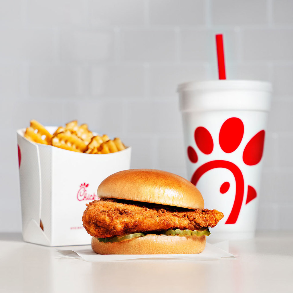 An image of a Chick-fil-A meal. A chicken sandwich, waffle fries, and a drink.