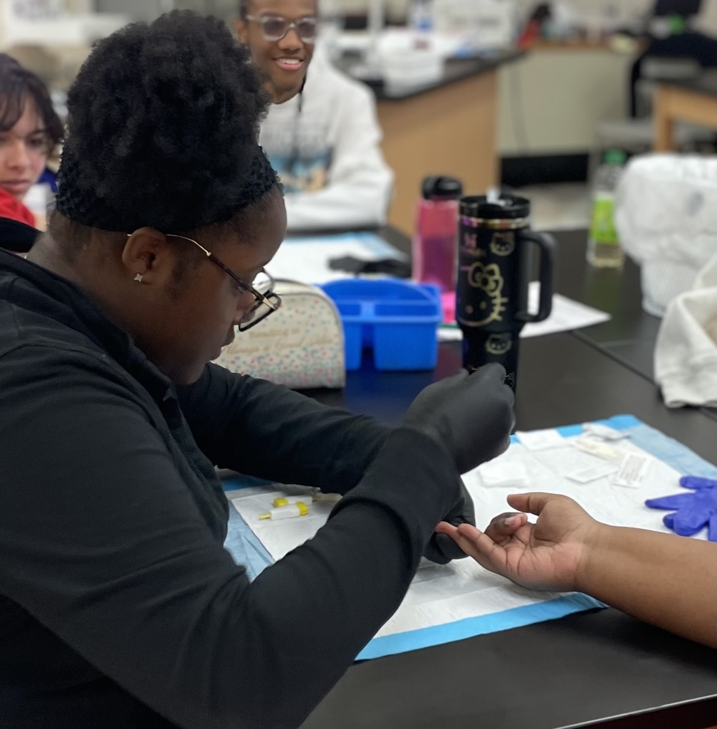students collecting a blood sample
