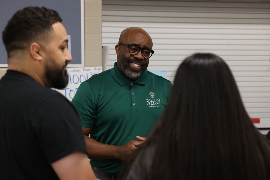 Parents, students, and community members eagerly speak to reps at the college fair