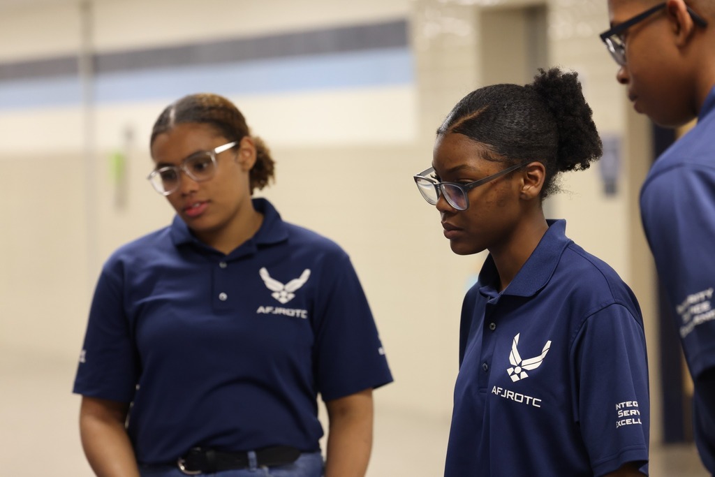 Parents, students, and community members eagerly speak to reps at the college fair