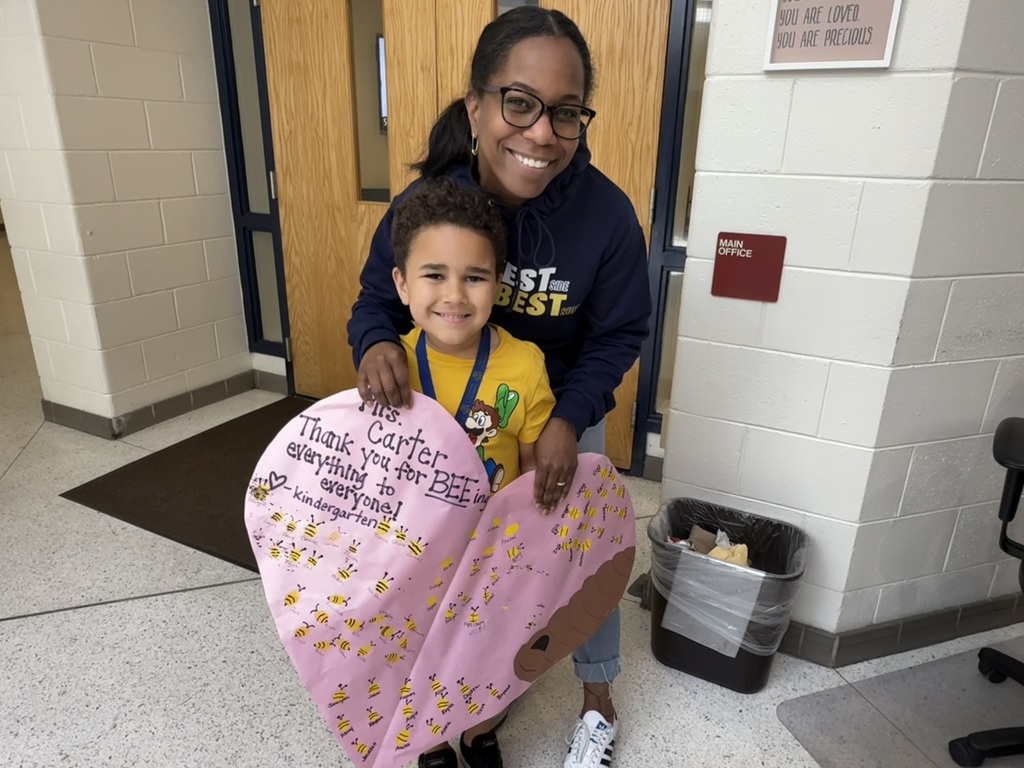 kindergarten students with heart signs appreciating the secretaries