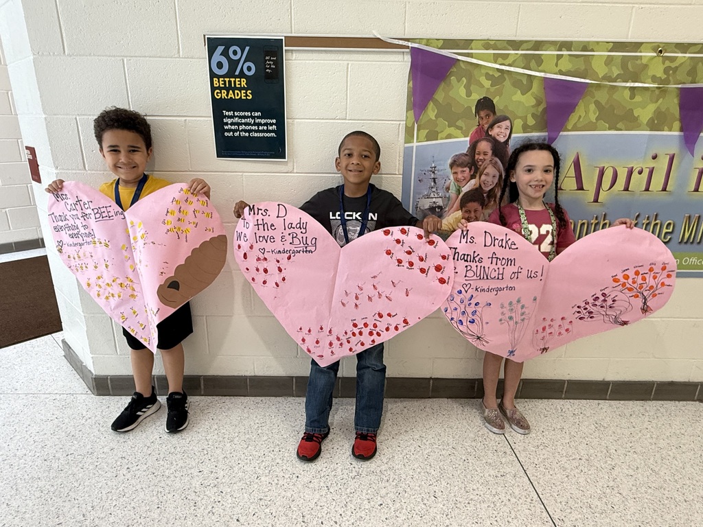 kindergarten students with heart signs appreciating the secretaries