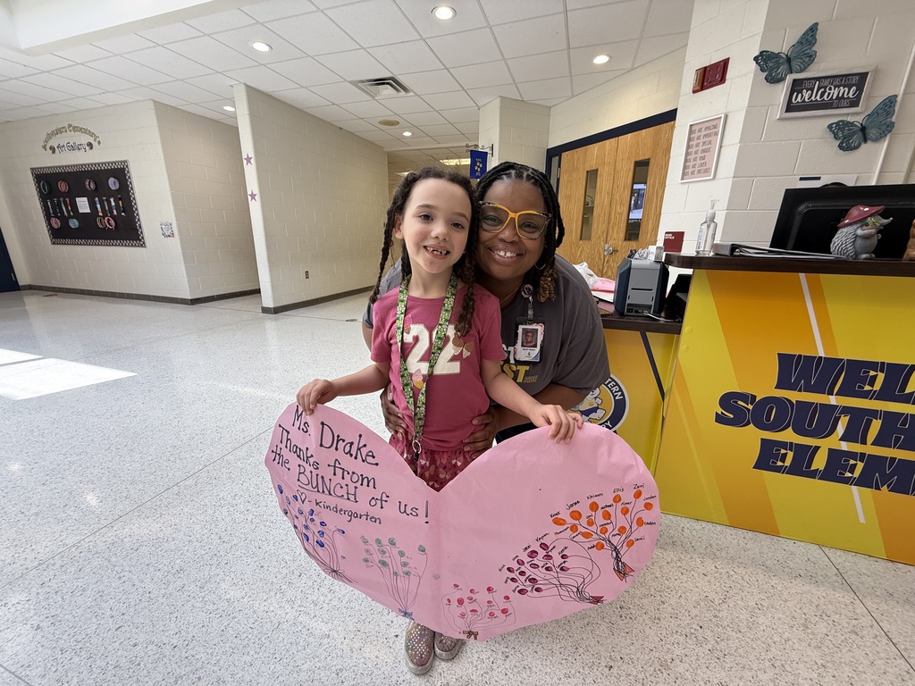 kindergarten students with heart signs appreciating the secretaries