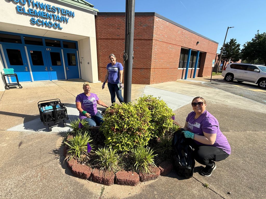 volunteers gardening at swe