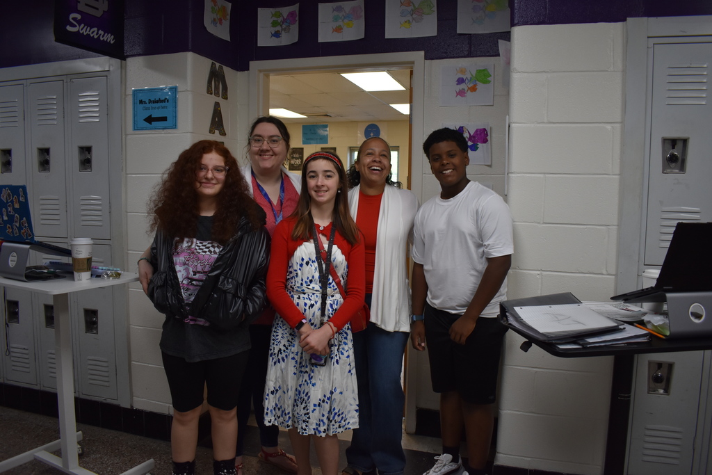 A group of teachers and students wearing their red white and blue