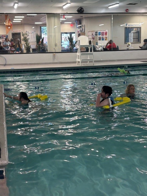 students swimming at a local YMCA 