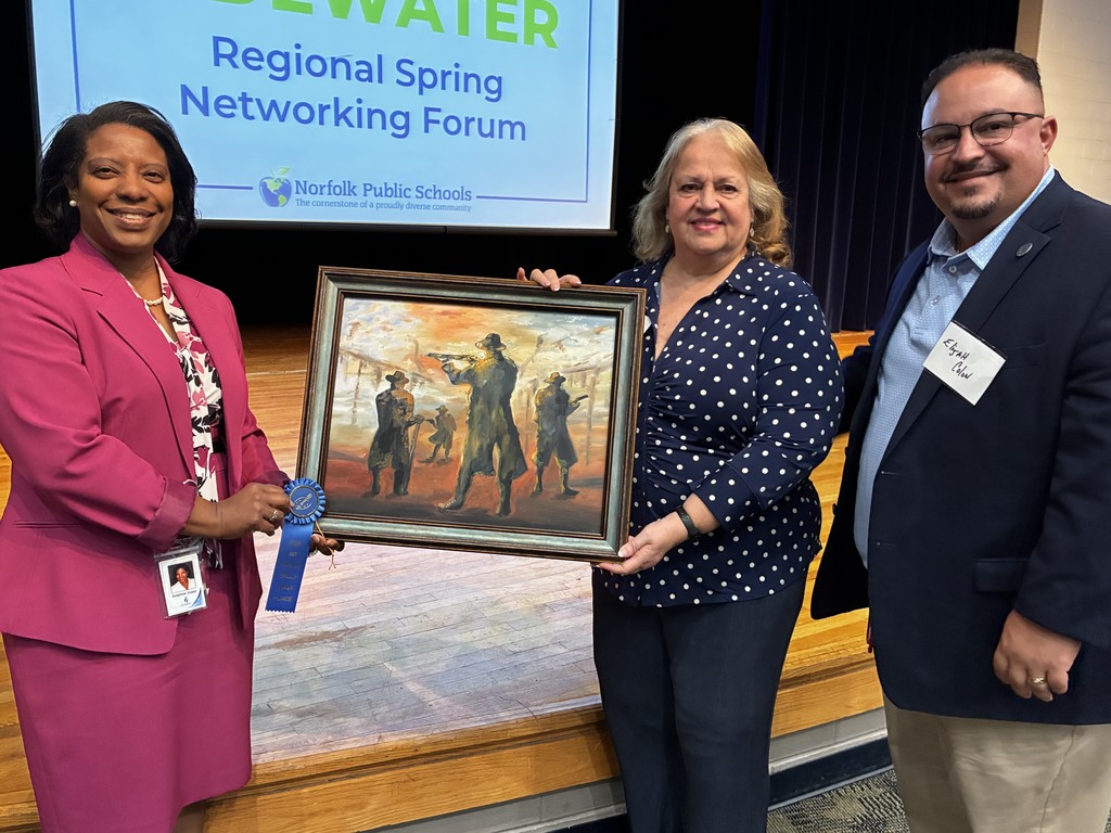 School board members proudly display student artwork