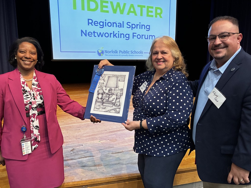 School board members proudly display student artwork