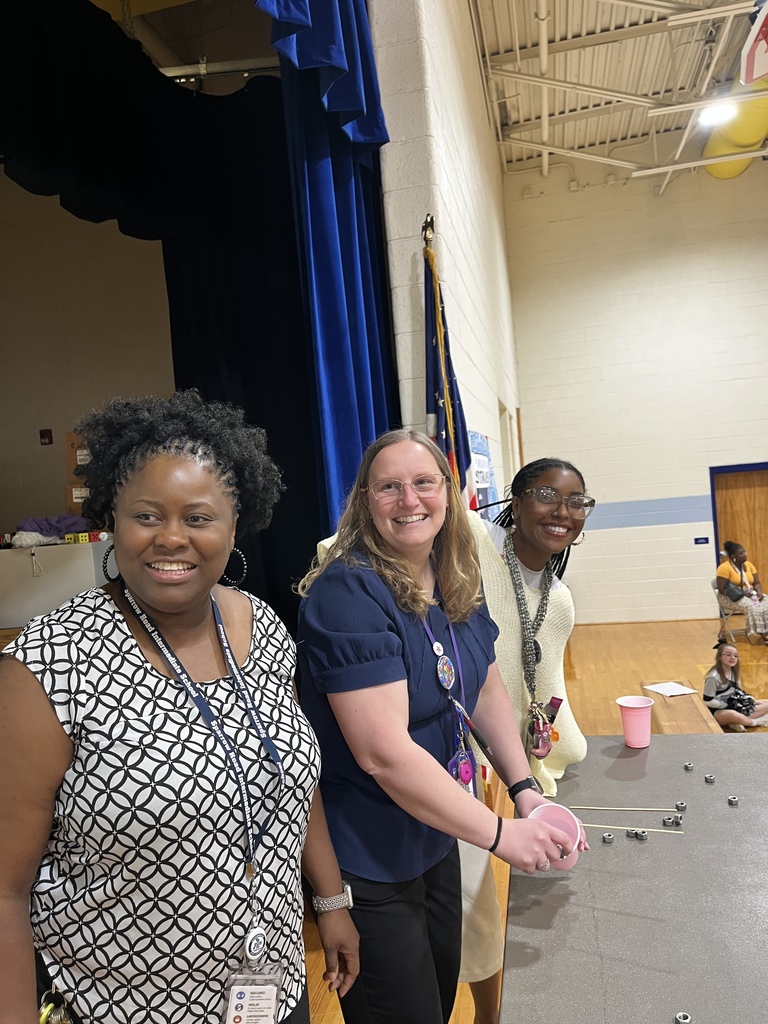 Staff excitedly on stage for the RISE challenge. 