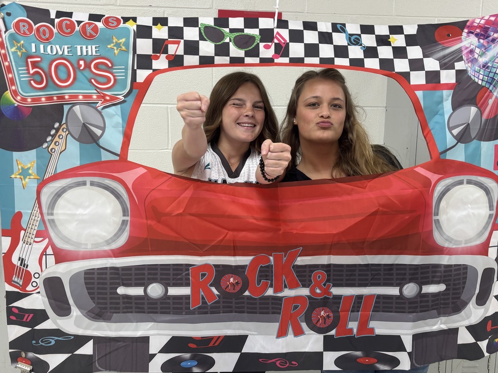 Students posing in a car for the 1950s event
