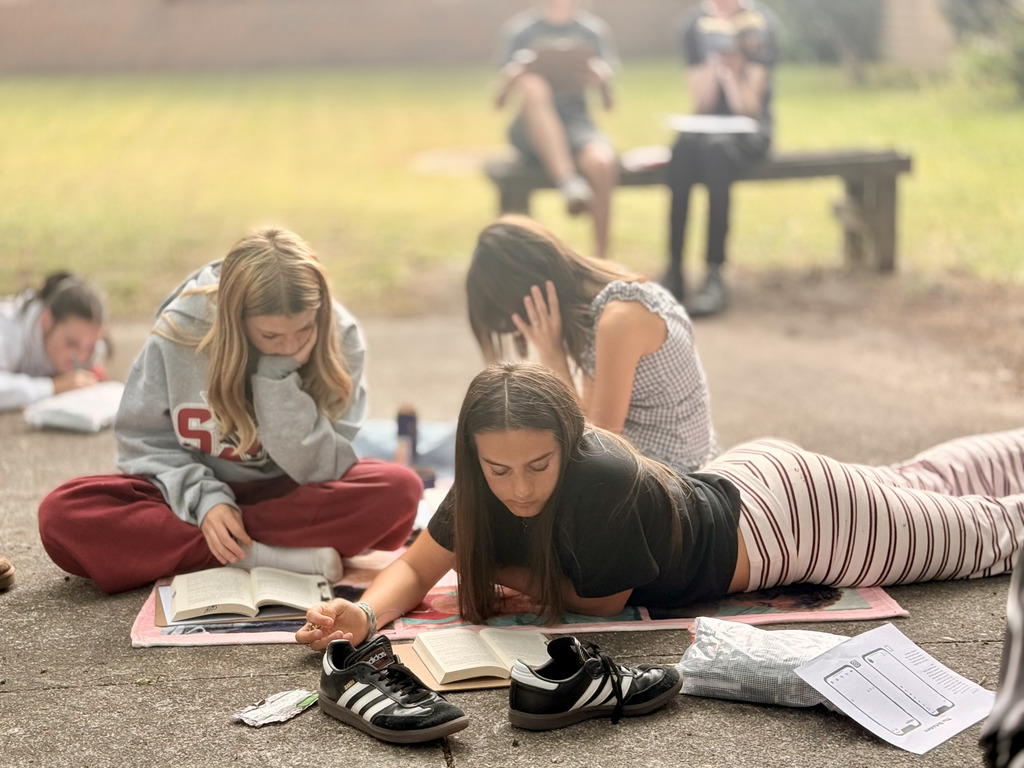 students enjoying nice weather while reading