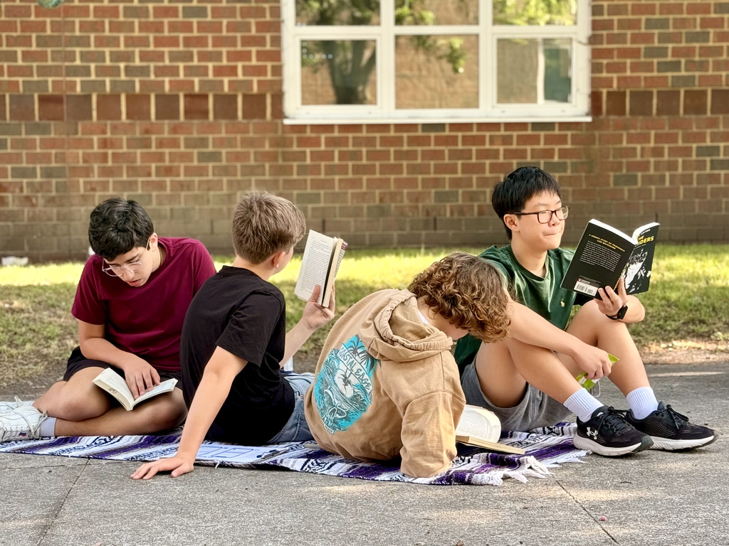 students enjoying nice weather while reading