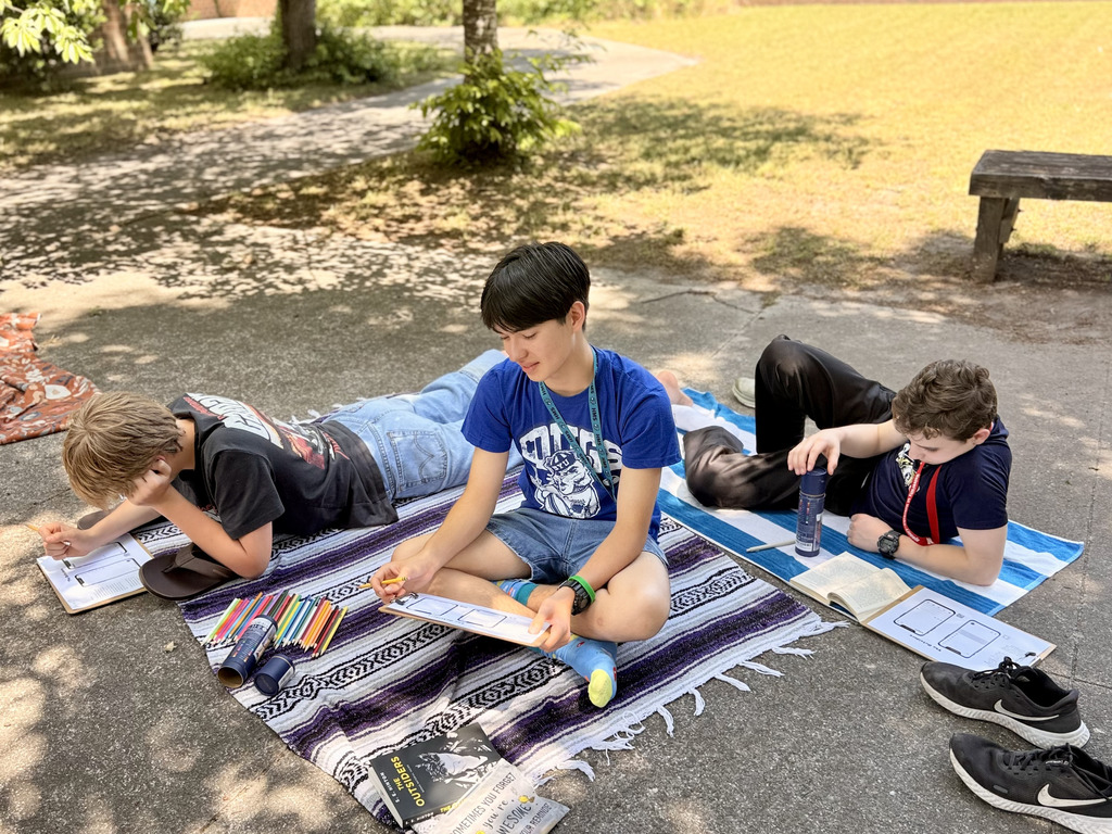 students enjoying nice weather while reading