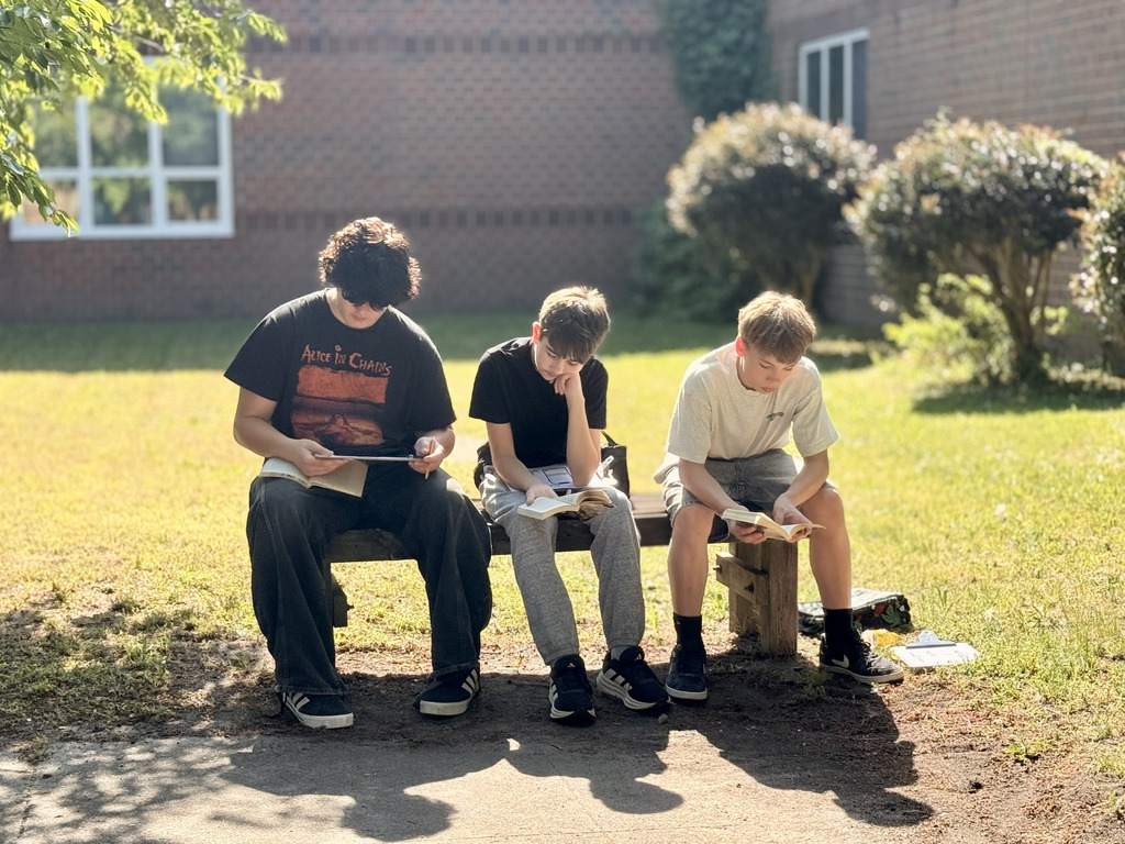 students enjoying nice weather while reading