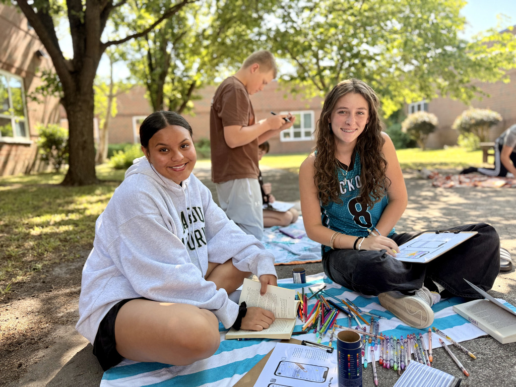 students enjoying nice weather while reading