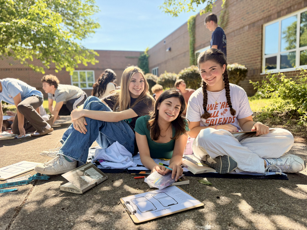 students enjoying nice weather while reading