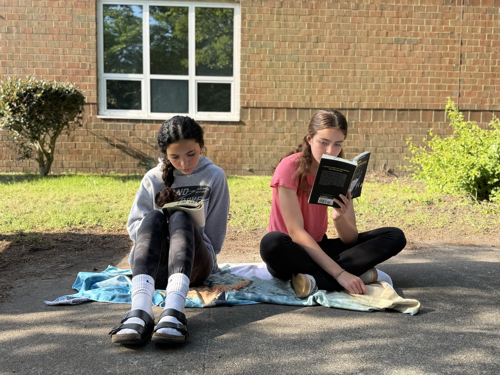 students enjoying nice weather while reading