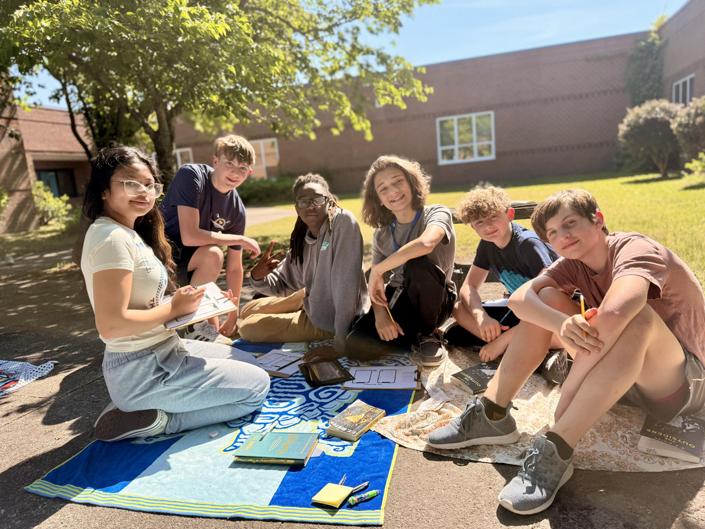students enjoying nice weather while reading