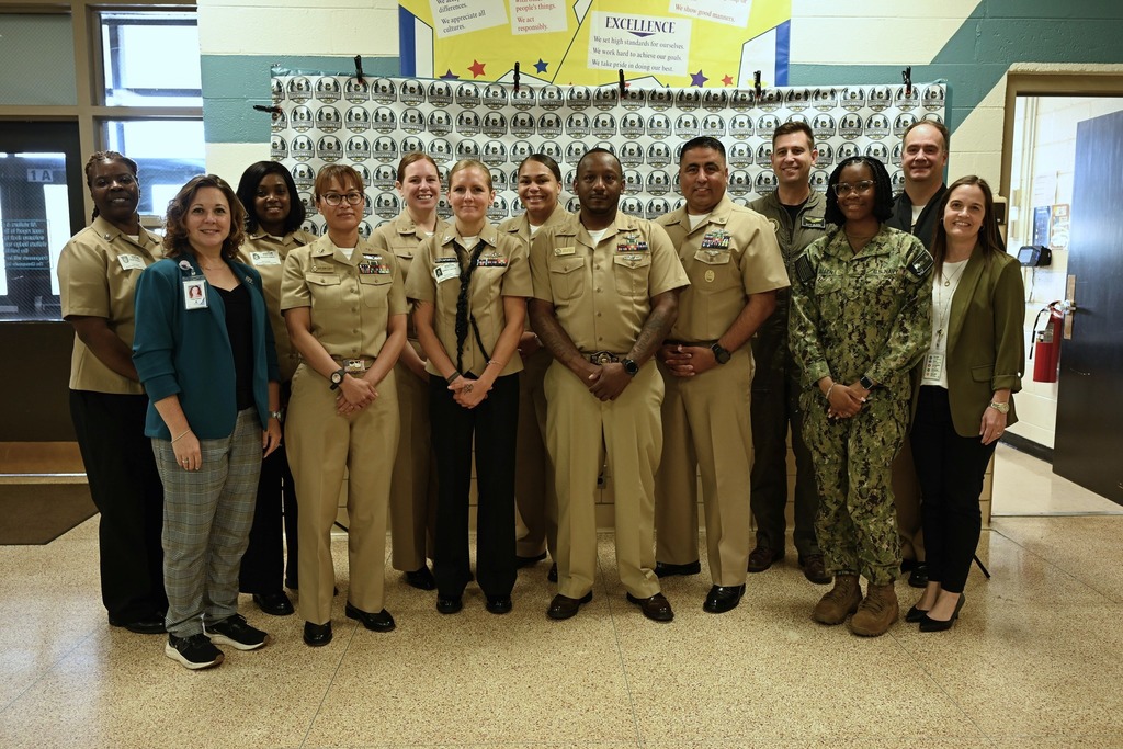 NSA team stands proudly posing for a picture