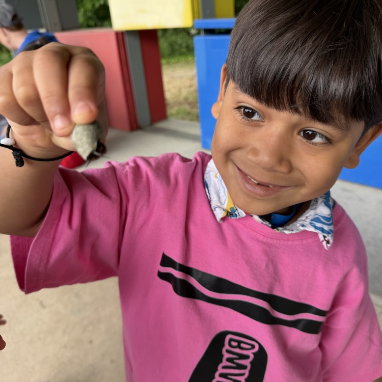 student holding a shell