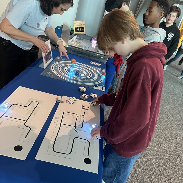 students using Ozobots on space maps. 