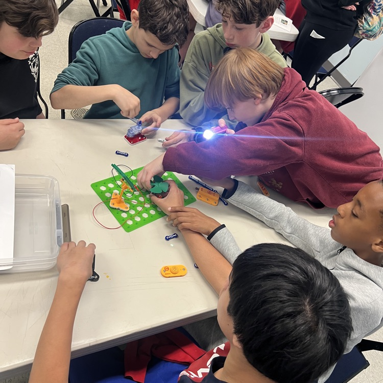 Students working together on a snap circuit project.  
