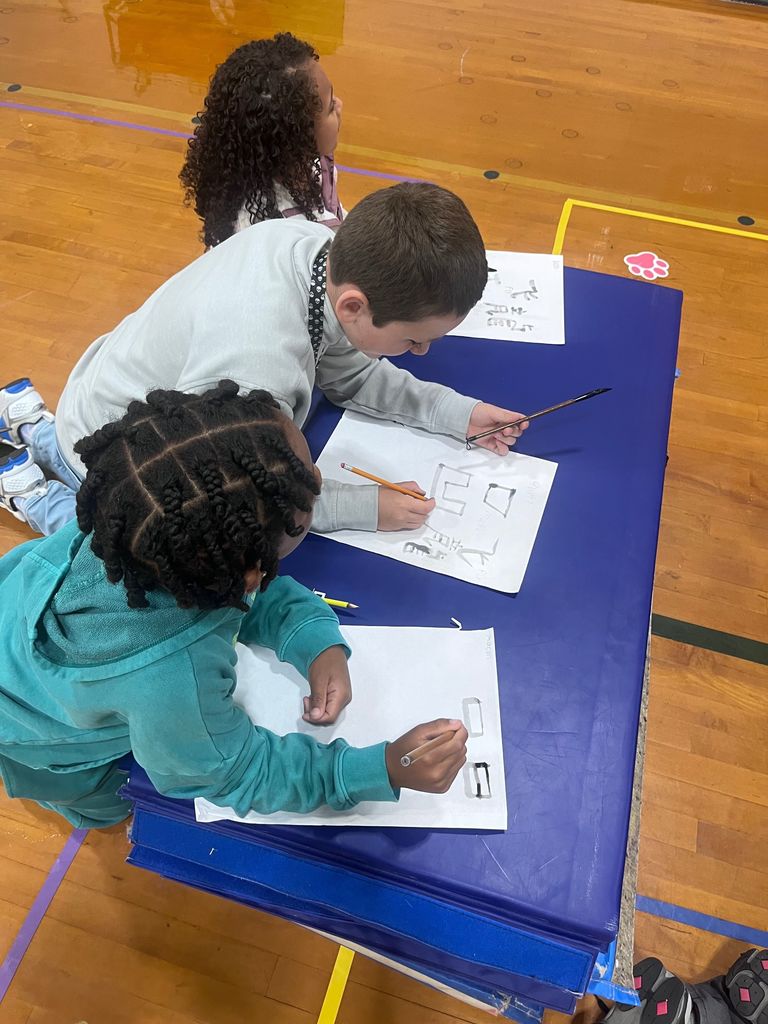students exploring artifacts from ancient China
