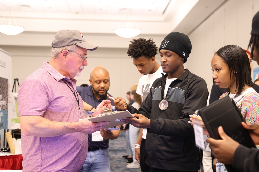Students gather at the Beyond the Diploma event to ask questions of employers