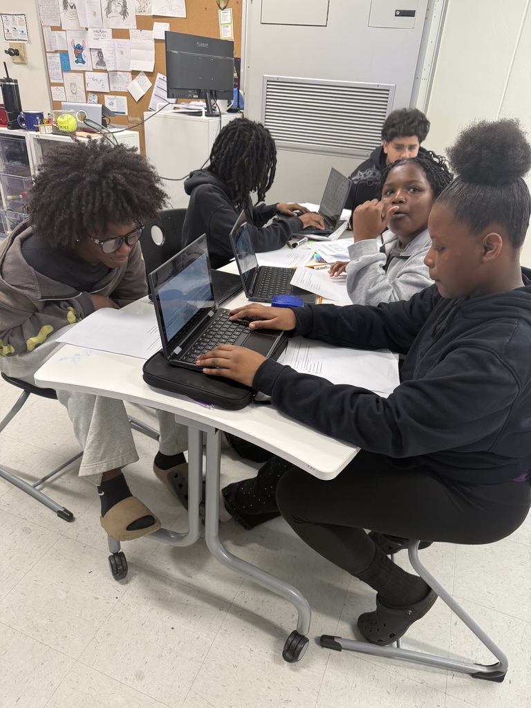 middle school students working together to review math skills