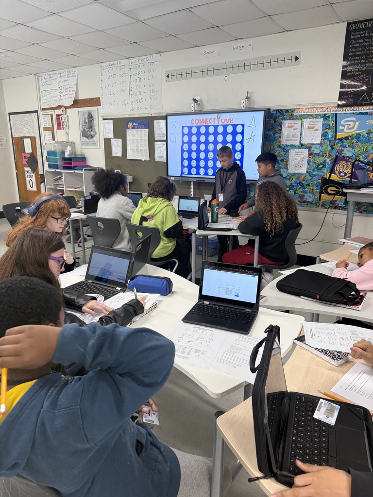 middle school students working together to review math skills