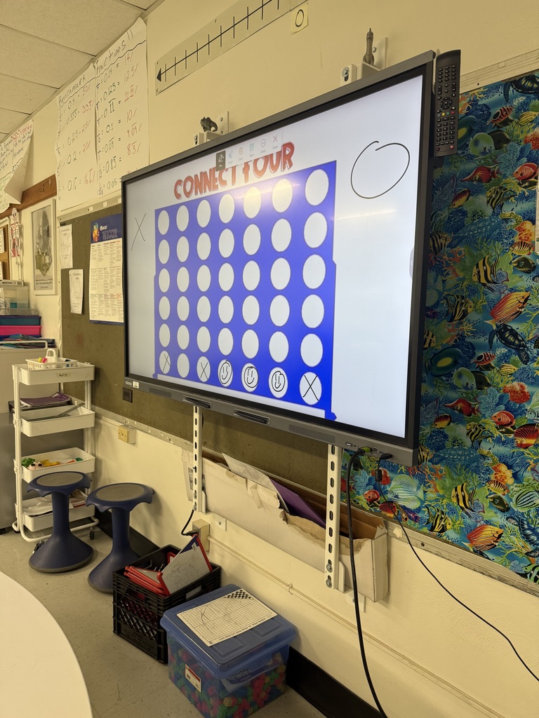 connect four board in a classroom used for a math review game
