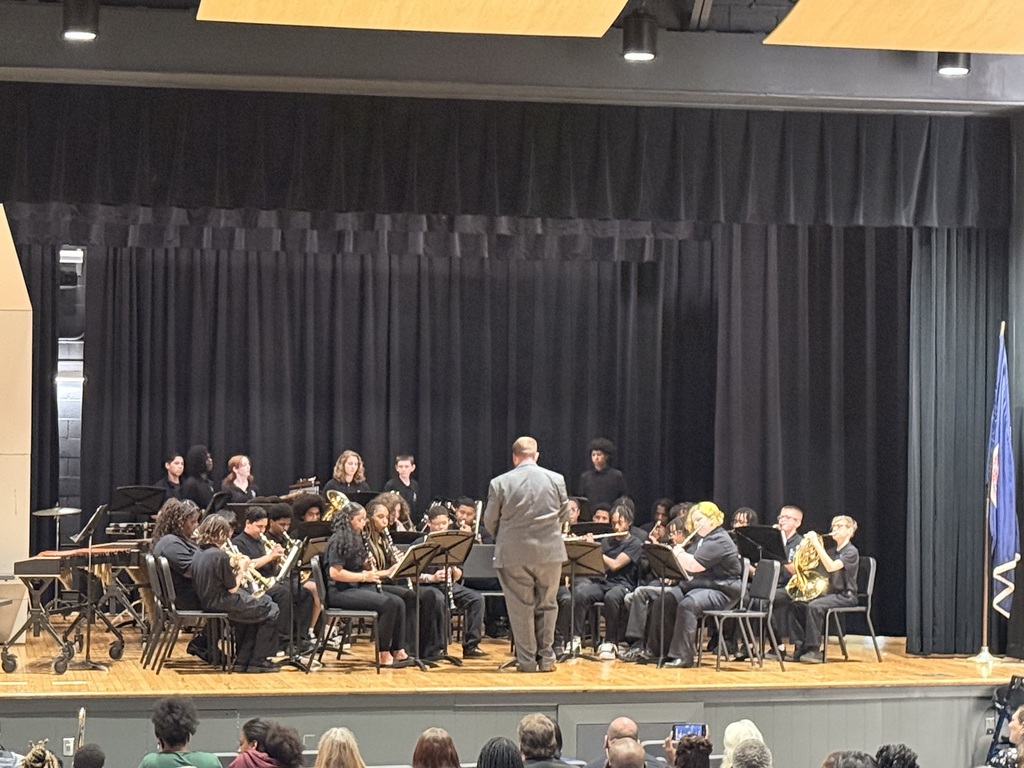 middle school students performing in a band concert