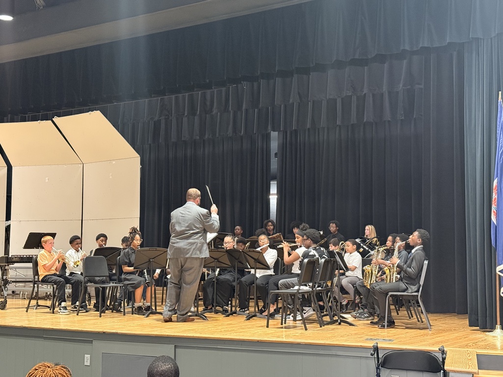 middle school students performing in a band concert