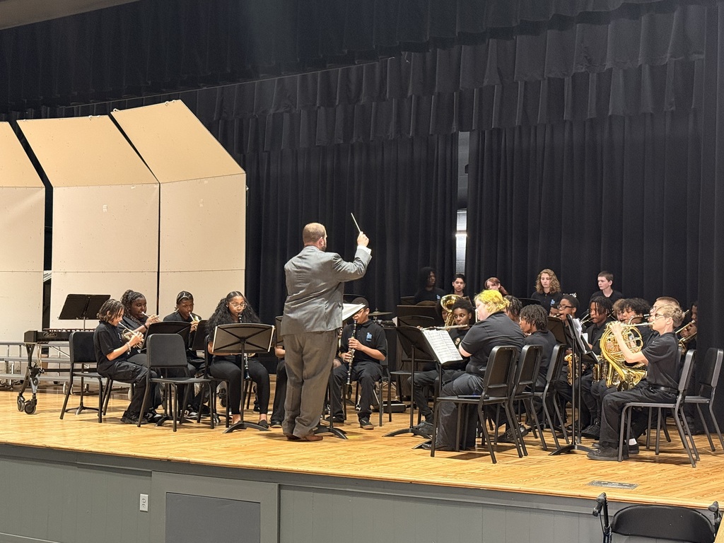 middle school students performing in a band concert