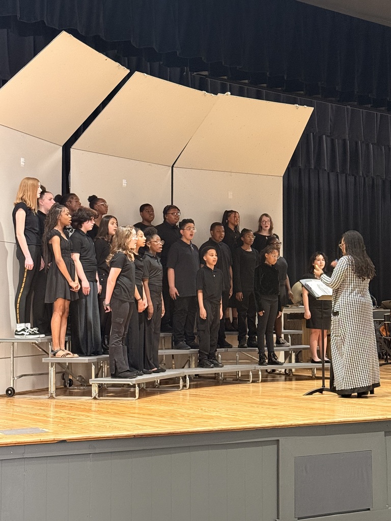 middle school students performing in a chorus concert