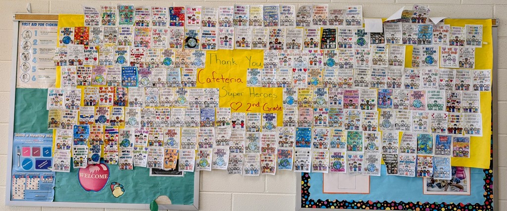 The students' illustrations often depict the staff members, globes, and various food items like cookies and fruit, underscoring the impact these individuals have on the students' daily lives.