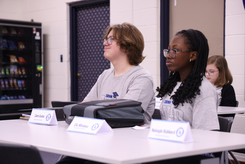 Two students in a panel discussion.