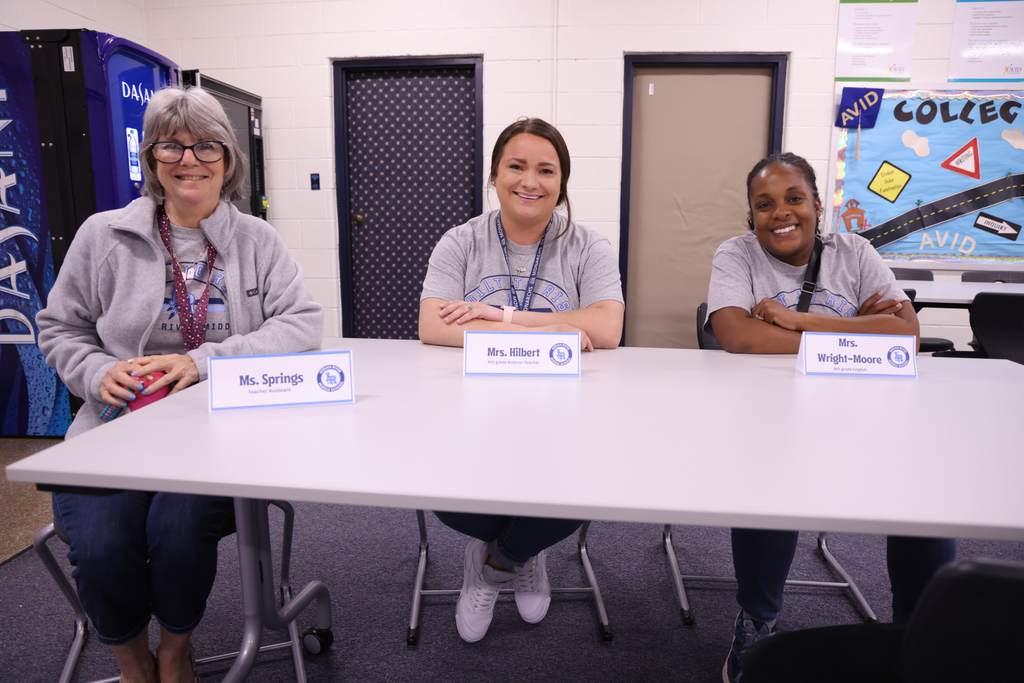 Three IRM teachers smiling.
