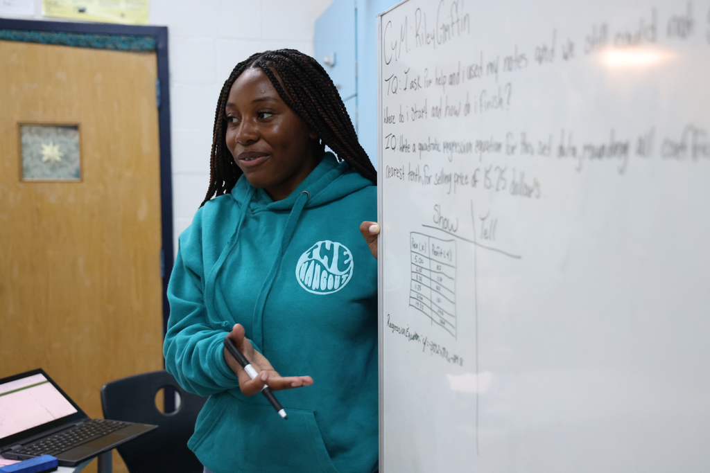 A student teaching content to the class.