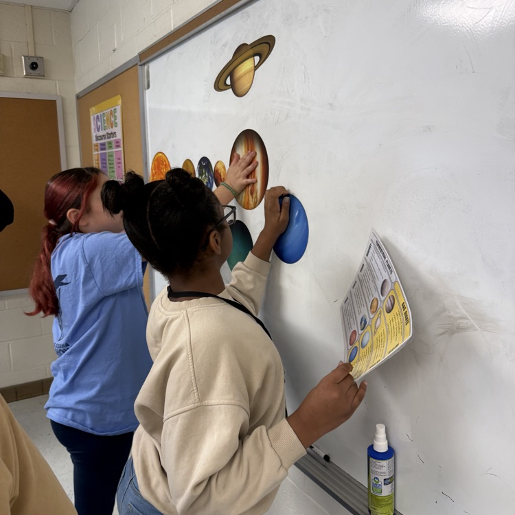 Students order the planets from the sun. 