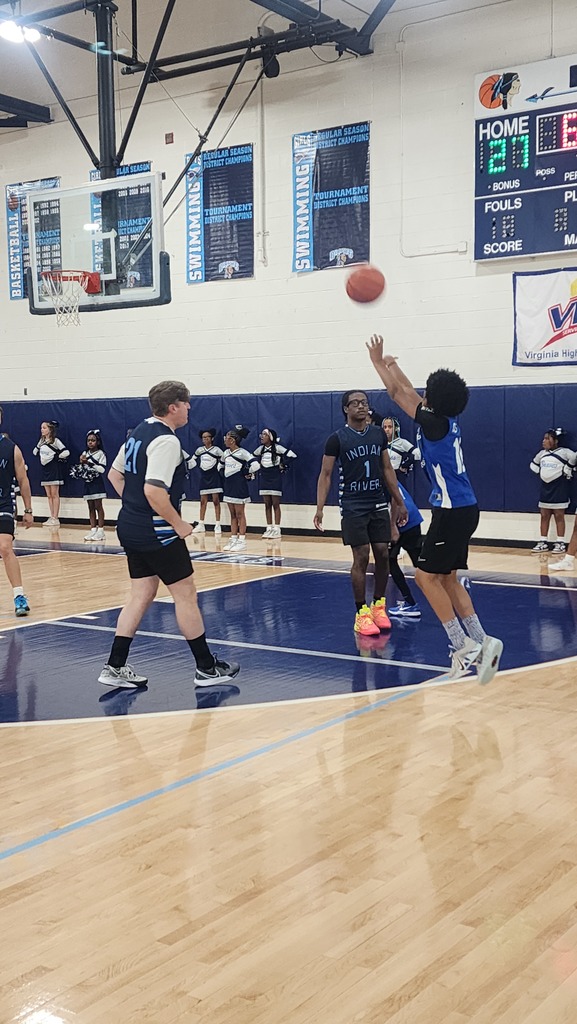SRI Student basketball player taking a shot during the game!