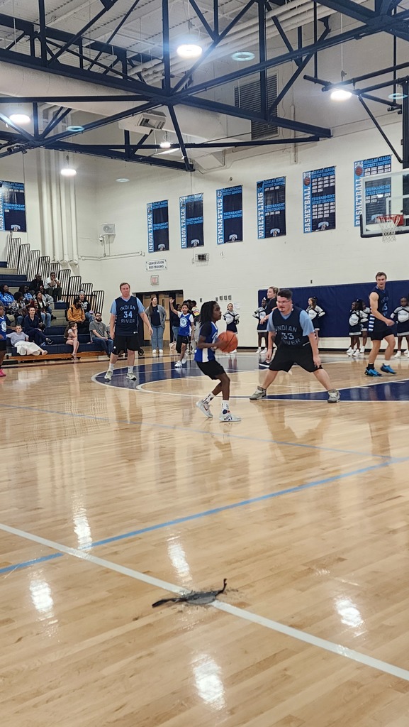 Student have the basketball and is getting ready to pass.