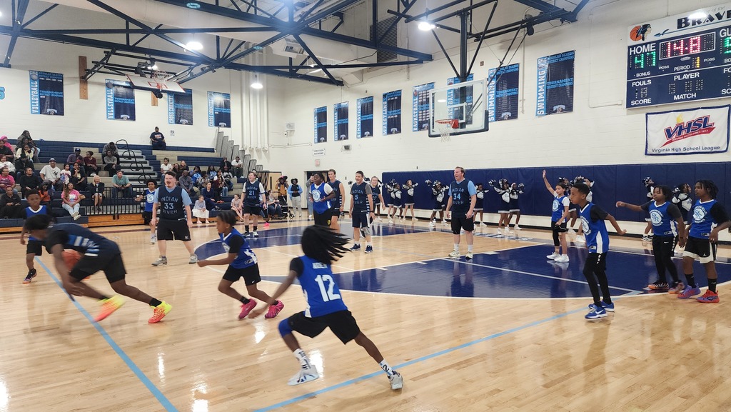 Teams running up the court during the game.