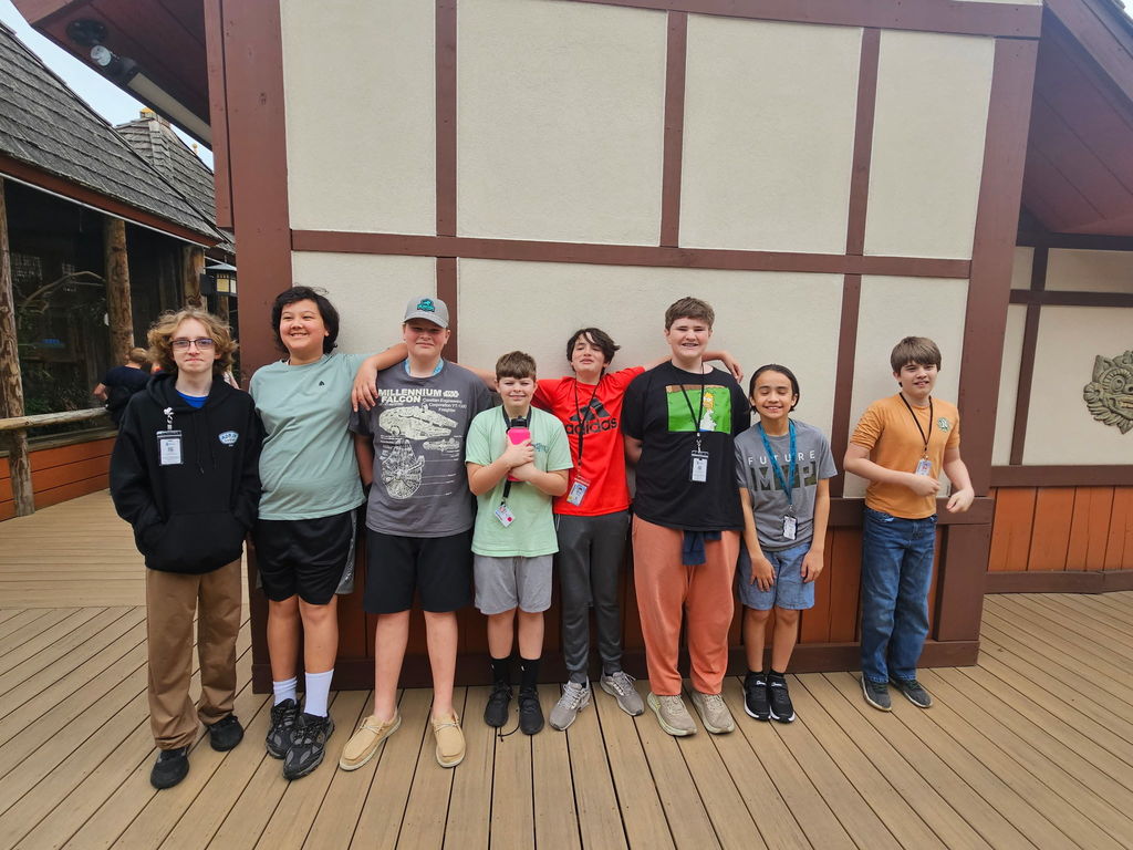 students at the zoo posing for a picture