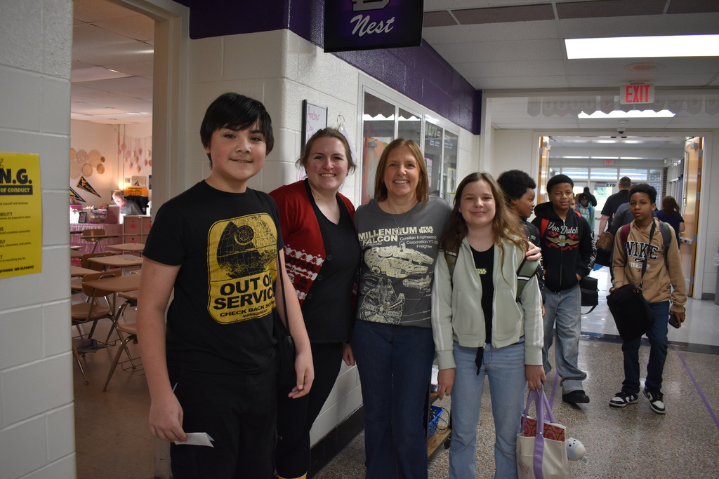 Two teachers and two students wearing a their star wars tshirts!