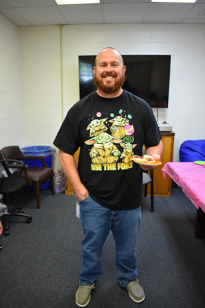 A teacher enjoying his biscuit for teacher appreciation week!
