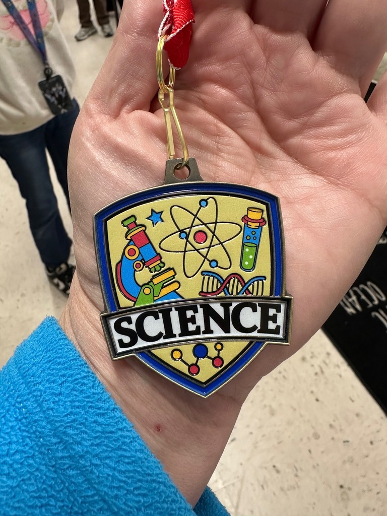 science badge in student's hand