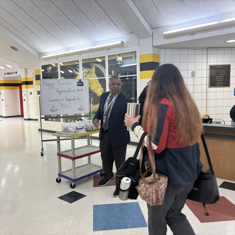 administrator is passing out candy for teacher appreciation