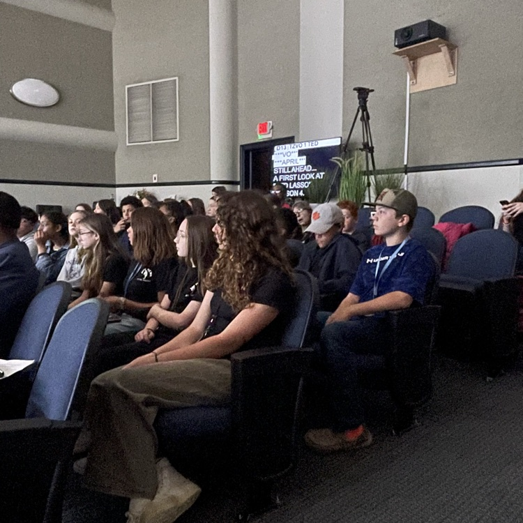 students looking at a live broadcasting